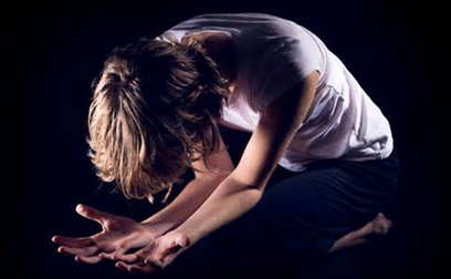 Deep Surrender to God: Woman Kneeling in Prayer